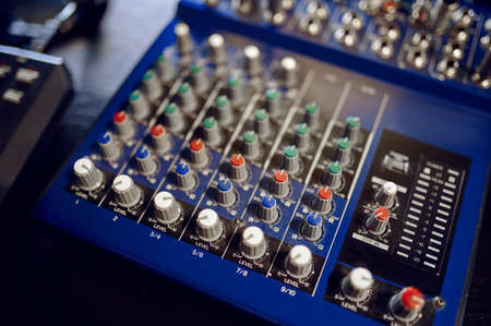 Mixing console closeup, recording studio equipment