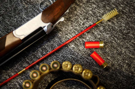 Hunting rifle, bandolier and ramrod in gun store