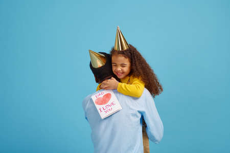 Little girl congratulates her father, birthdayの写真素材