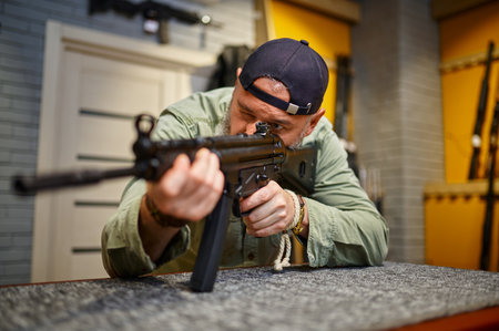 Bearded man checks the rifle scope in gun store