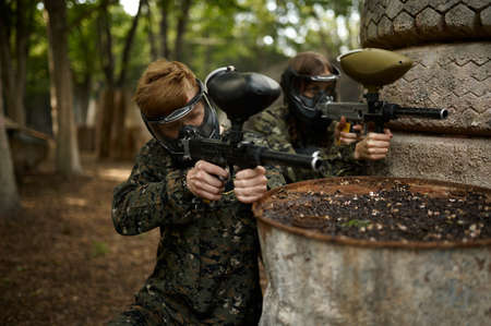 Warriors aimimg with paintball guns, team gameの写真素材