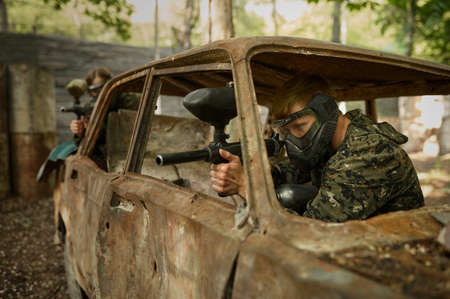 Warriors shooting with paintball guns, team game