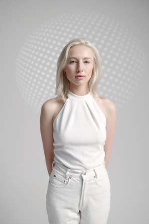 Futuristic young woman in white clothesの写真素材