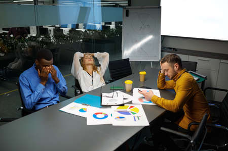 Team of managers at table, conference in IT officeの写真素材