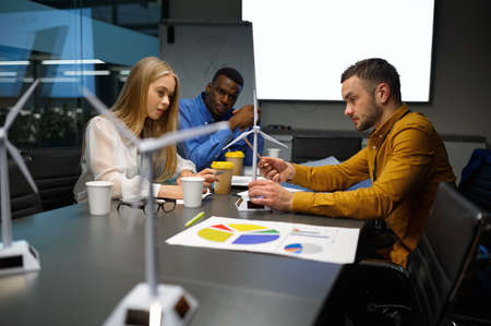 Team of young managers, conference in IT officeの写真素材