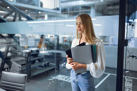 Female manager, IT office interior on background