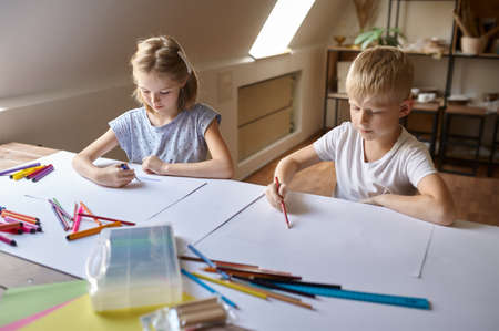 Children drawing at the table, kids in workshop