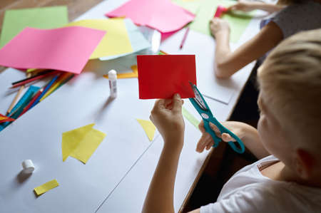 Children cut colored paper, kids in art schoolの写真素材