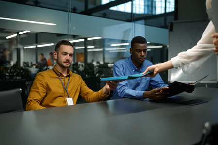 Team of managers, meeting in IT business officeの写真素材