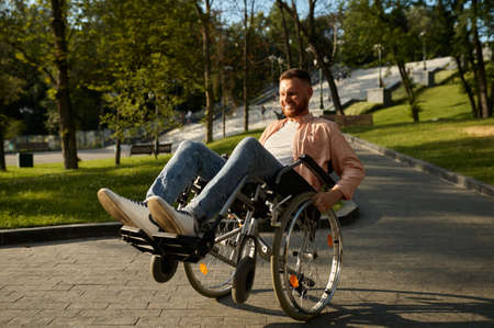 Young man in wheelchair shows his skill