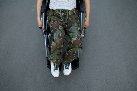 Handicapped military person in wheelchair, top viewの写真素材