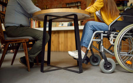 Disabled grandfather and granddaughter play chessの写真素材