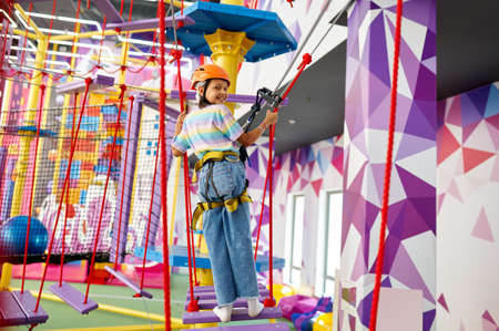 Little girl on zip line in entertainment center