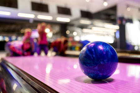 Ball on the lane, children in bowling alley