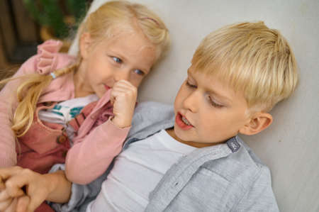 Funny children lying in a hammock, summer campingの写真素材