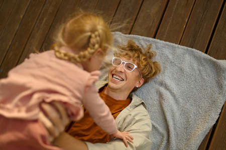 Daddy and gaughter play on terrace at the trailerの写真素材