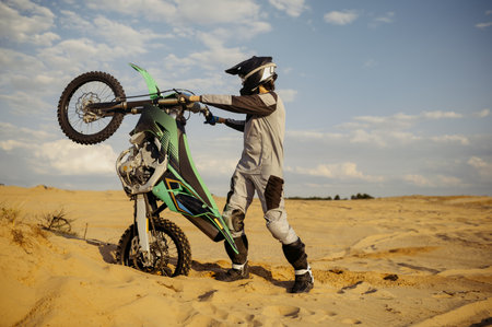 Skilled moto rider making stunt on motorbikeの写真素材