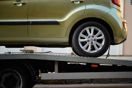 Closeup car fixed on tow truck vehicleの写真素材