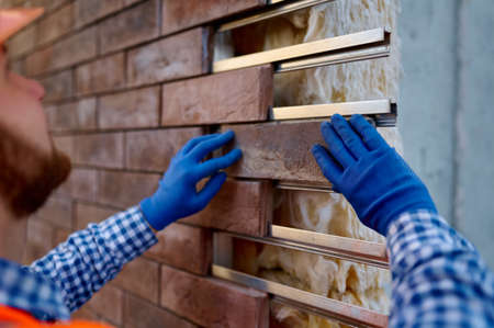 Worker cladding stone for external wall warmingの写真素材