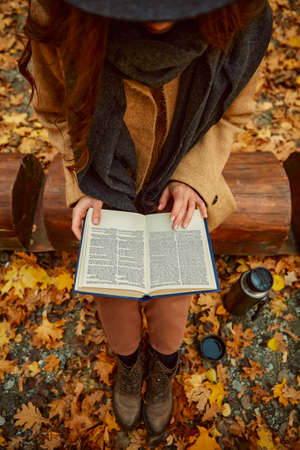 Woman rest reading book in autumn forest