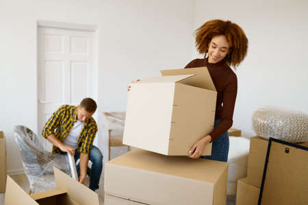 Happy couple packing beginnings before home movingの写真素材