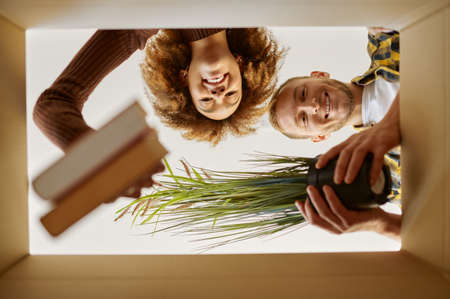 Couple packing boxes for move bottom view