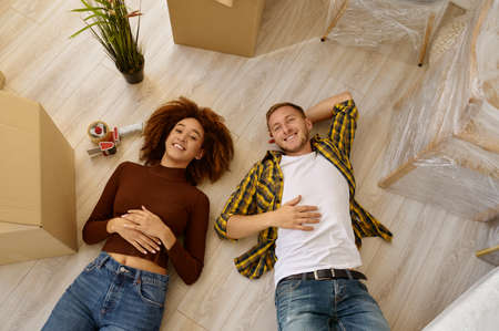 Happy couple on floor view from aboveの写真素材