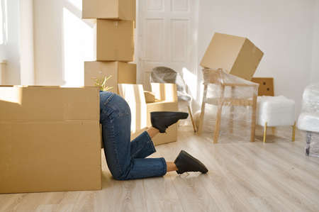 Funny woman looking something in big boxの写真素材