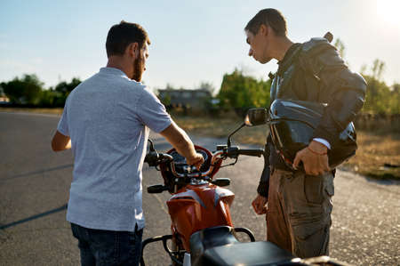 Male student and instructor, lesson in motorschoolの写真素材