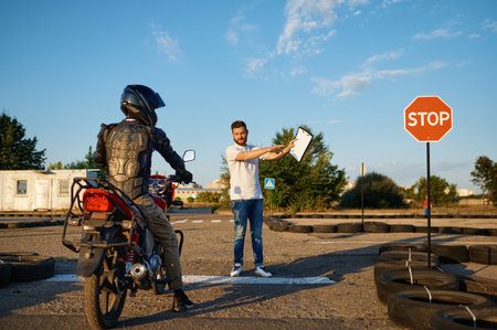 Male student and instructor, test on motordromeの写真素材