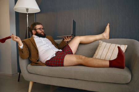 Man freelancer communicating via video call chatの写真素材