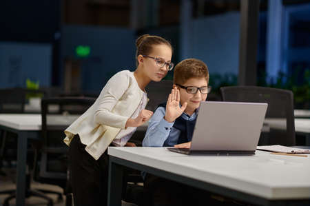 Girl and boy holding business video call