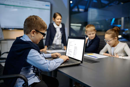 Meeting of smiling diverse children business team