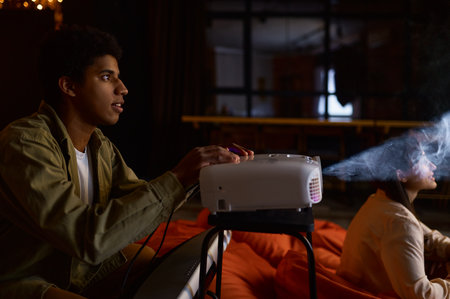 Young couple preparing to watch movie filmの写真素材