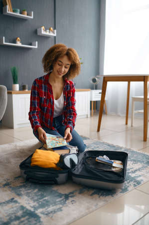 Young woman getting ready on weekend vacationの写真素材