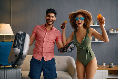 Couple enjoy packing clothes and travel stuff