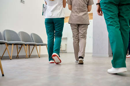 Hospital corridor with walking doctors cropped shotの写真素材