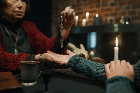 Mature witch using crystal pendulum to predict future for client