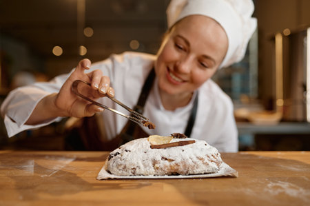 Bread bakery worker decorating diet wheat loaf or bun