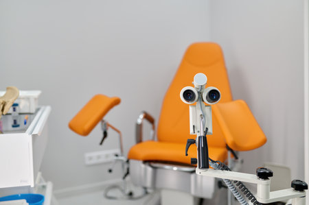 Gynecological chair and examination equipment in modern prenatal clinic officeの写真素材