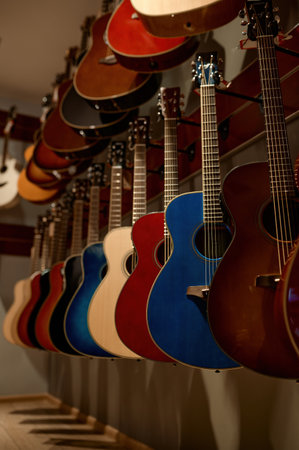 Selective focus on rack of guitar string instrument at music shopの写真素材