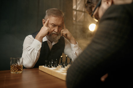 Senior man chess player touching temples feeling lost in thoughts