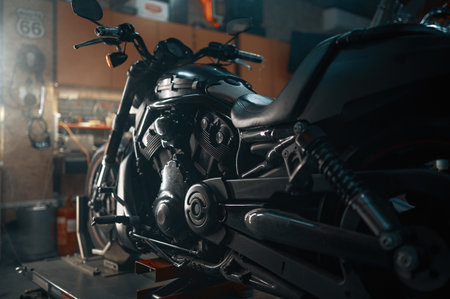 Custom motorcycle in authentic creative workshop with flare light visual effectsの写真素材