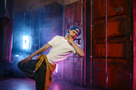 Cool Hip hop dancer in trendy street clothes dancingの写真素材