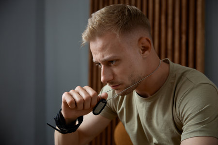 Closeup face portrait of emotional military man feeling stress