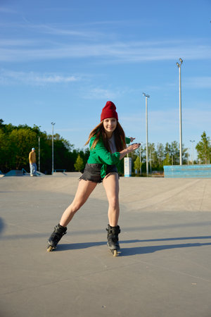 Healthy teenager girl enjoys rollerblading speed movesの写真素材