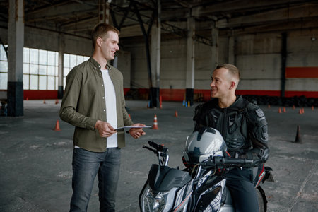 Student learning how to drive motorcycle with one hand