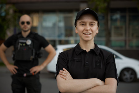 Smiling woman patrol police officer on the street