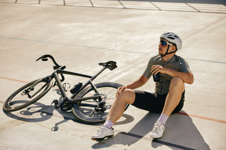 Sportsman resting enjoying refreshing time during cycling training