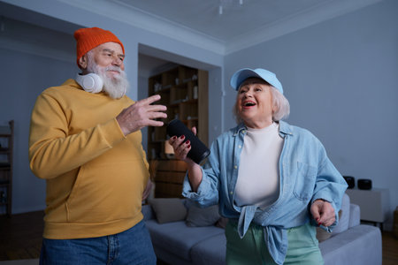 Elderly couple wearing trendy fashion outfit with youth clothing styleの写真素材